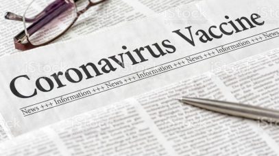 A newspaper with the headline Coronavirus Vaccine